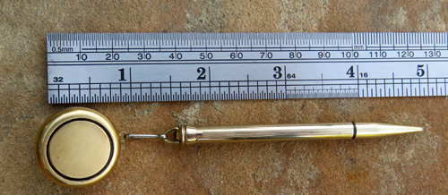 GOLD FILLED CROSS PENCIL ON RETRACTING CABLE BROOCH